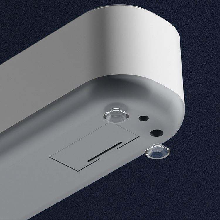 Close-up of the cleaner base showing the one-touch button and suction feet